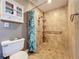 Accessible bathroom featuring a tile walk-in shower, grab bars, and storage at 5127 Leeward Way, Orlando, FL 32809