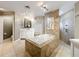 Bright bathroom featuring soaking tub, vanity, and walk-in shower at 5127 Leeward Way, Orlando, FL 32809