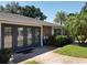 Exterior view features a brick entryway, double doors, and well-maintained landscaping at 5127 Leeward Way, Orlando, FL 32809