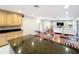 Spacious kitchen island with granite counters and seating, perfect for entertaining and casual dining at 5127 Leeward Way, Orlando, FL 32809