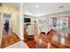 Bright living room with hardwood floors and sliding glass doors leading to an outdoor pool at 5127 Leeward Way, Orlando, FL 32809