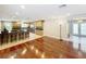 Bright, open space that seamlessly blends the kitchen bar area and living room at 5127 Leeward Way, Orlando, FL 32809