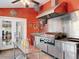 Outdoor kitchen featuring stainless steel appliances, ample counter space and a double-door entrance at 5127 Leeward Way, Orlando, FL 32809