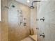 Spacious tile shower with multiple shower heads and controls at 5127 Leeward Way, Orlando, FL 32809