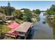 Breathtaking waterfront view with dock, boat lift, and beautiful natural surroundings, perfect for lake living at 5127 Leeward Way, Orlando, FL 32809