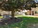 Shady backyard featuring a charming Magnolia tree with swing, a well-kept lawn and home with a patio at 5127 Leeward Way, Orlando, FL 32809