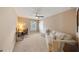 Cozy bedroom with a couch and a work desk; perfect for relaxing and working at 5262 Baskin St, Orlando, FL 32814