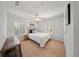 Cozy bedroom featuring neutral decor, ceiling fan, and ample natural light from dual windows at 5262 Baskin St, Orlando, FL 32814