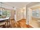 Inviting dining area with hardwood floors, neutral walls, and access to a powder room at 5262 Baskin St, Orlando, FL 32814