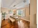 Elegant dining room featuring hardwood floors, natural light, and a modern chandelier at 5262 Baskin St, Orlando, FL 32814
