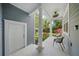 Charming front porch with a seating area, pillars, and a view of the front yard at 5262 Baskin St, Orlando, FL 32814