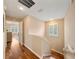 Upstairs hallway features hardwood floors, natural light and access to bedrooms at 5262 Baskin St, Orlando, FL 32814