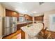 Bright and spacious kitchen with granite countertops, stainless steel appliances, and a breakfast bar at 5262 Baskin St, Orlando, FL 32814