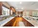Open kitchen featuring granite countertops, stainless steel appliances, and hardwood flooring at 5262 Baskin St, Orlando, FL 32814