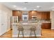 Modern kitchen featuring a large island, stainless steel appliances, and ample cabinet space at 5262 Baskin St, Orlando, FL 32814