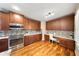 Well-equipped kitchen with stainless steel appliances, granite countertops, and ample cabinet storage at 5262 Baskin St, Orlando, FL 32814