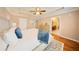 Spacious main bedroom features a tray ceiling, fan and ensuite bathroom at 5262 Baskin St, Orlando, FL 32814