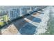 Sweeping aerial shot of oceanfront condos next to a scenic beach with crashing waves at 5275 S Atlantic Ave # 506, New Smyrna Beach, FL 32169