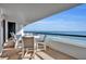 Spacious balcony with ocean view and outdoor seating at 5275 S Atlantic Ave # 506, New Smyrna Beach, FL 32169
