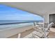 Balcony with outdoor seating and ocean view at 5275 S Atlantic Ave # 506, New Smyrna Beach, FL 32169