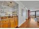 Wet bar area with wooden cabinets, granite counters, and a great ocean view at 5275 S Atlantic Ave # 506, New Smyrna Beach, FL 32169