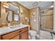 Bathroom featuring custom vanity and walk-in shower at 5275 S Atlantic Ave # 506, New Smyrna Beach, FL 32169