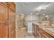 Bathroom featuring double vanity, walk-in shower and wood cabinets at 5275 S Atlantic Ave # 506, New Smyrna Beach, FL 32169