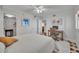 Bedroom with ceiling fan, hardwood floors and dedicated desk area at 5275 S Atlantic Ave # 506, New Smyrna Beach, FL 32169
