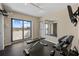 Exercise room showcasing weight bench, mirror, and sliding door access at 5275 S Atlantic Ave # 506, New Smyrna Beach, FL 32169