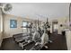 Fitness center equipped with treadmills and elliptical machines, with a view to the water at 5275 S Atlantic Ave # 506, New Smyrna Beach, FL 32169