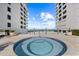 Community hot tub between two buildings with ocean view at 5275 S Atlantic Ave # 506, New Smyrna Beach, FL 32169