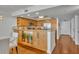 Bright kitchen featuring wooden cabinetry, stainless steel appliances, and granite countertops at 5275 S Atlantic Ave # 506, New Smyrna Beach, FL 32169