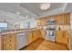 Kitchen featuring stainless steel appliances, granite countertops, and hardwood flooring with an open layout at 5275 S Atlantic Ave # 506, New Smyrna Beach, FL 32169