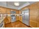 Kitchen showcasing stainless steel appliances, hardwood flooring, and granite countertops at 5275 S Atlantic Ave # 506, New Smyrna Beach, FL 32169