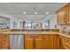 Kitchen close-up features granite countertops, stainless steel appliances, and open view to living area at 5275 S Atlantic Ave # 506, New Smyrna Beach, FL 32169