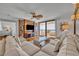 Comfortable living room boasting a plush sofa, entertainment center, and balcony access with an ocean view at 5275 S Atlantic Ave # 506, New Smyrna Beach, FL 32169