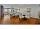 Inviting living room with hardwood floors, neutral decor, and access to a beachfront balcony at 5275 S Atlantic Ave # 506, New Smyrna Beach, FL 32169
