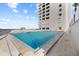 Exterior shot of the pool, surrounding area and view of the beach at 5275 S Atlantic Ave # 506, New Smyrna Beach, FL 32169