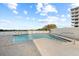 Community pool area with ocean view and a lounge area at 5275 S Atlantic Ave # 506, New Smyrna Beach, FL 32169