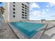 Resort-style pool with lounge chairs and ocean views at 5275 S Atlantic Ave # 506, New Smyrna Beach, FL 32169