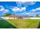 Expansive backyard with pool, privacy fence, and manicured lawn offers the ultimate space for outdoor enjoyment at 554 Appleton Pl, Oviedo, FL 32765
