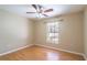 Bright bedroom features a ceiling fan, a window with natural light, and attractive, easy-care floors at 554 Appleton Pl, Oviedo, FL 32765