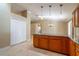Bright and open kitchen area shows granite countertops and tile flooring at 554 Appleton Pl, Oviedo, FL 32765