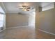 Spacious living room with ceramic tile flooring, ceiling fan, and natural light at 554 Appleton Pl, Oviedo, FL 32765