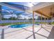 Enjoy the screened-in pool area, perfect for relaxing or entertaining, with clear blue water and a covered patio at 554 Appleton Pl, Oviedo, FL 32765