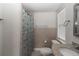 Bright bathroom features a tiled shower, granite countertop, and tiled floors at 5547 Garden Grove Cir, Winter Park, FL 32792