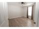Bedroom with natural light and wood-look laminate flooring throughout at 5547 Garden Grove Cir, Winter Park, FL 32792
