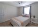 Bedroom with wood-look laminate flooring, closet, and ceiling fan at 5547 Garden Grove Cir, Winter Park, FL 32792