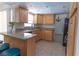 Bright kitchen featuring granite countertops, tile floors, and stainless steel appliances at 5547 Garden Grove Cir, Winter Park, FL 32792