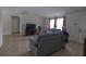 Comfortable living room featuring neutral tile flooring and ample natural light from the windows at 5547 Garden Grove Cir, Winter Park, FL 32792